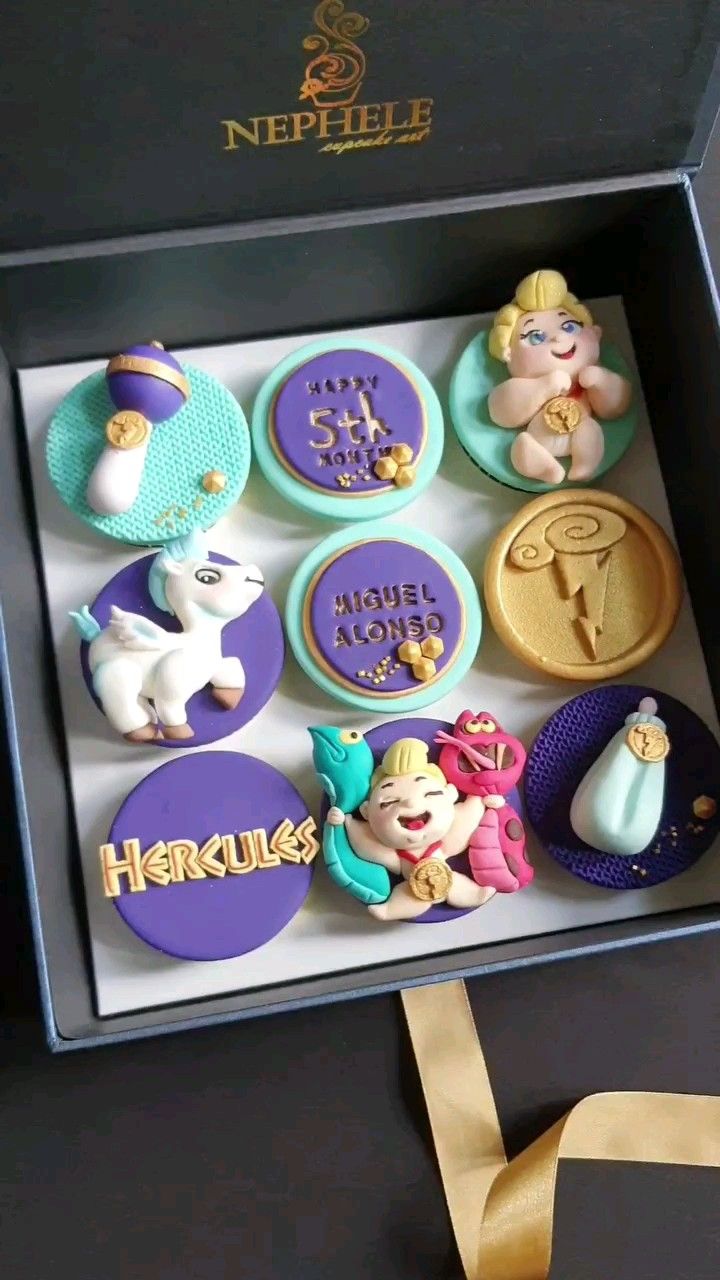 Nephele Cupcake Art ube cupcakes with Hercules-themed fondant art