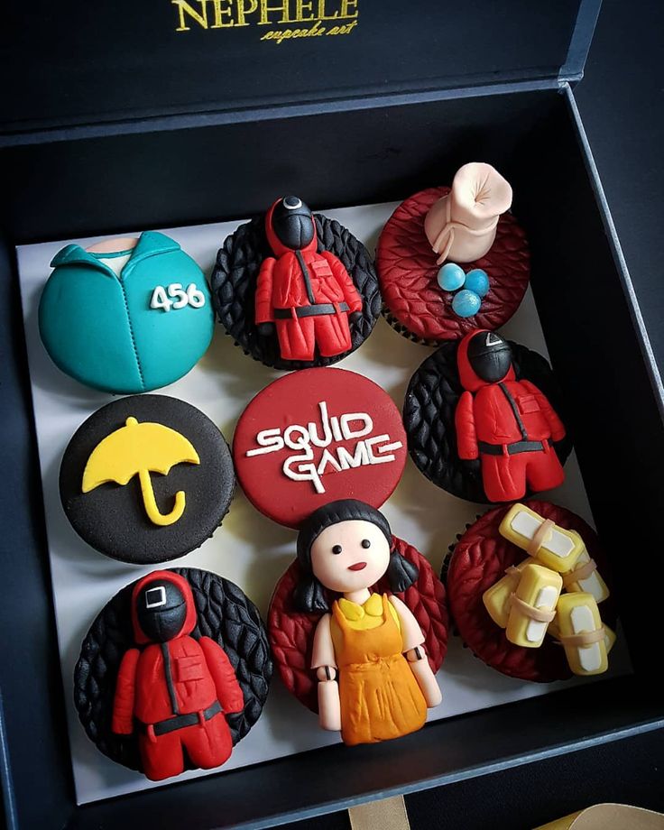 Nephele Cupcake Art red velvet cupcakes with themed fondant toppers